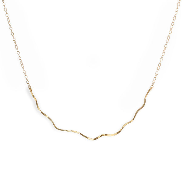 14k gold filled coastal route necklace on a white surface