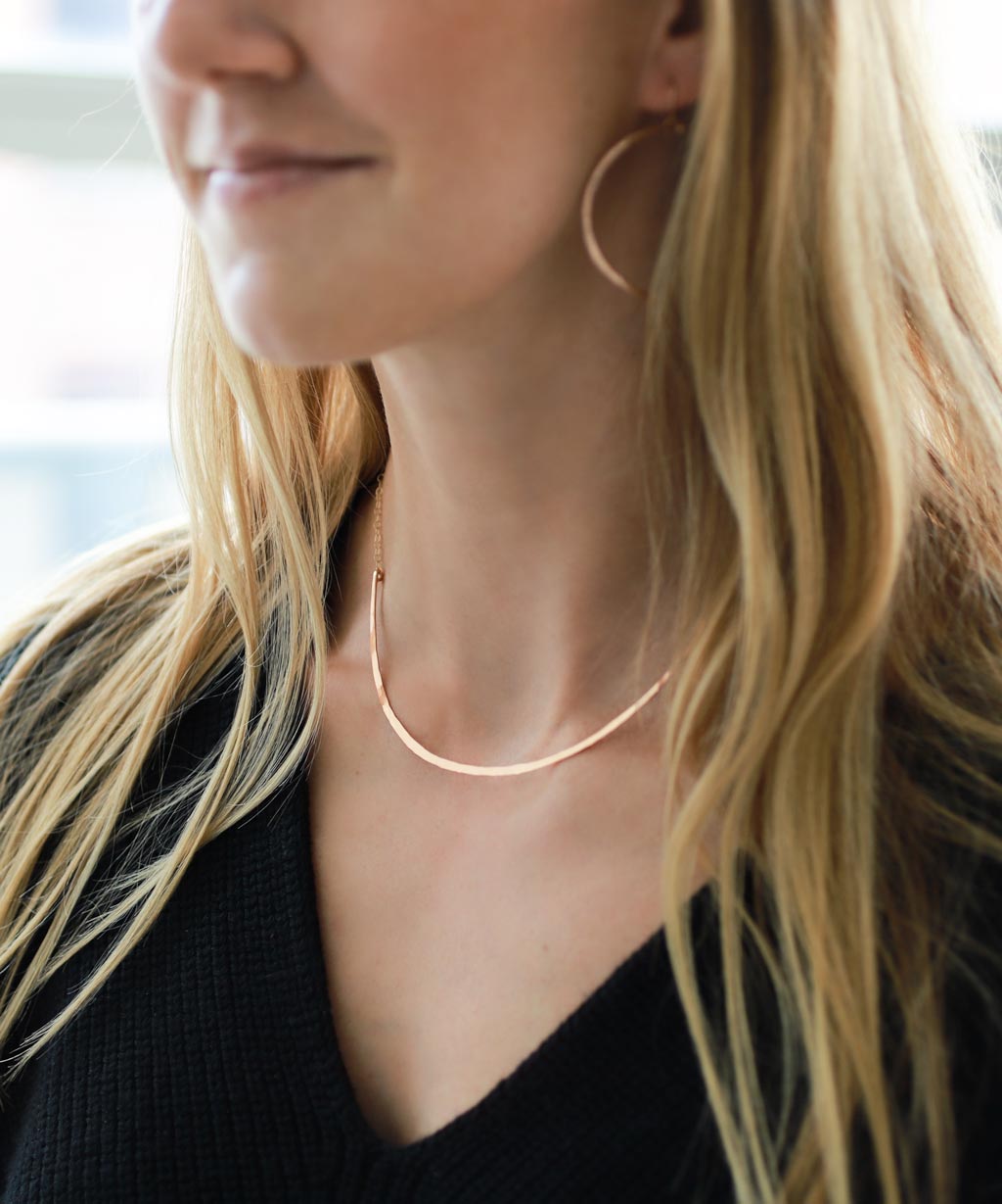 girl with rose gold collar necklace 