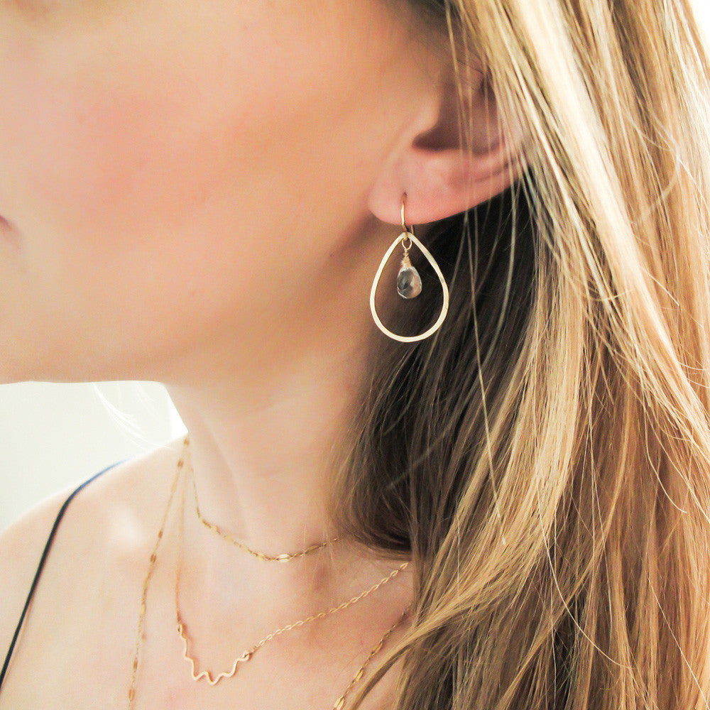 blond woman wearing 14k gold filled crystal quartz teardrop gemstone hoops