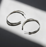 pair of silver irregular curve hoop earrings