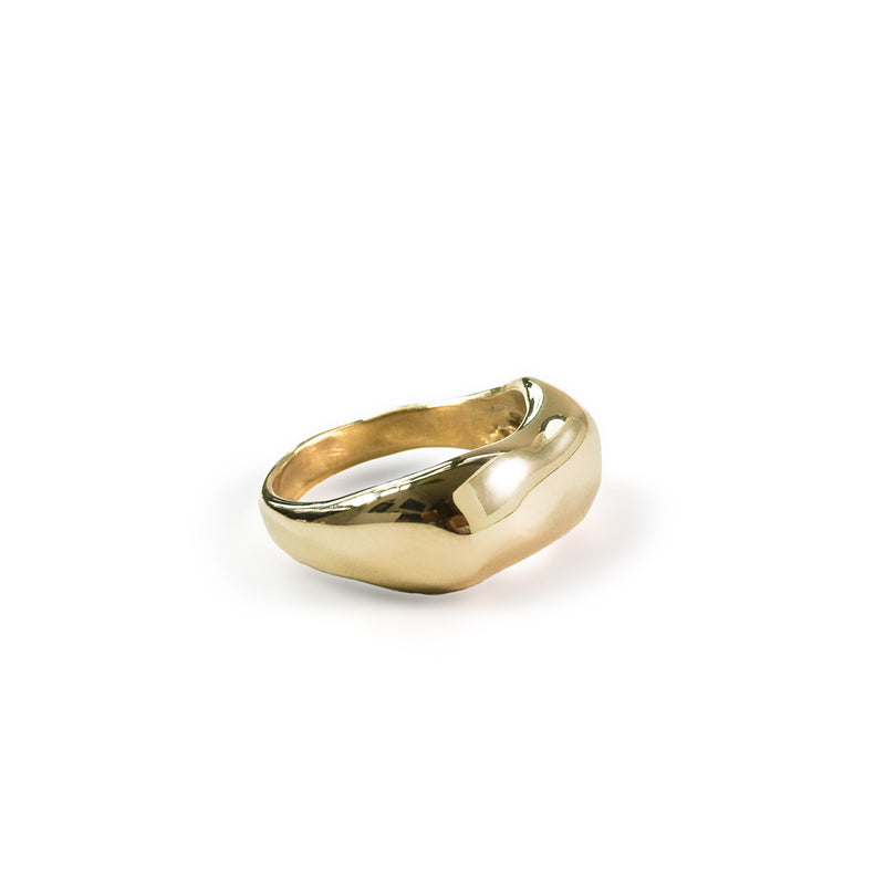 curve ring on white surface by delia langan jewelry