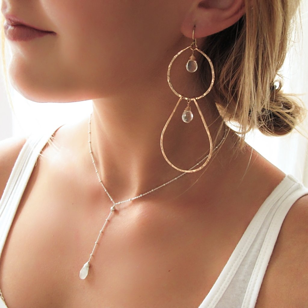 long rose gold hammered earrings with crystal quartz by delia langan jewelry