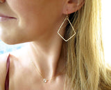 dainty geometric gold dangle earrings by delia langan jewelry