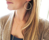 medium sized round hammered gold hoop earrings by delia langan jewelry