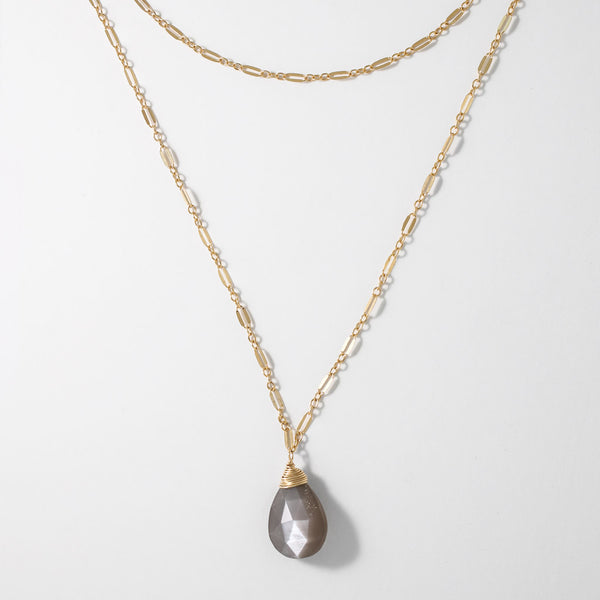 moonstone choker wrap gemstone necklace on white surface