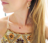 blond woman wearing 14k gold filled green amethyst teardrop gemstone earrings