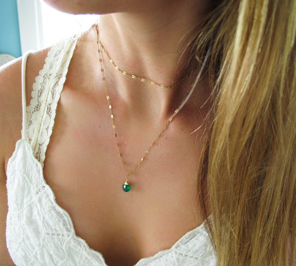blond woman on a white top wearing a 14k gold filled green onyx 33 inch choker wrap gemstone necklace