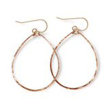 rose gold filled hoops for nuns hoop earrings on a white surface