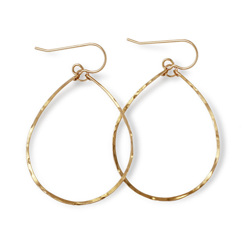 14k gold filled hoops for nuns hoop earrings on a white surface