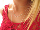 delicate silver wavy necklace layered with silver chain choker delia langan jewelry
