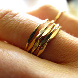 wavy delicate gold stacking rings made by delia langan jewelry