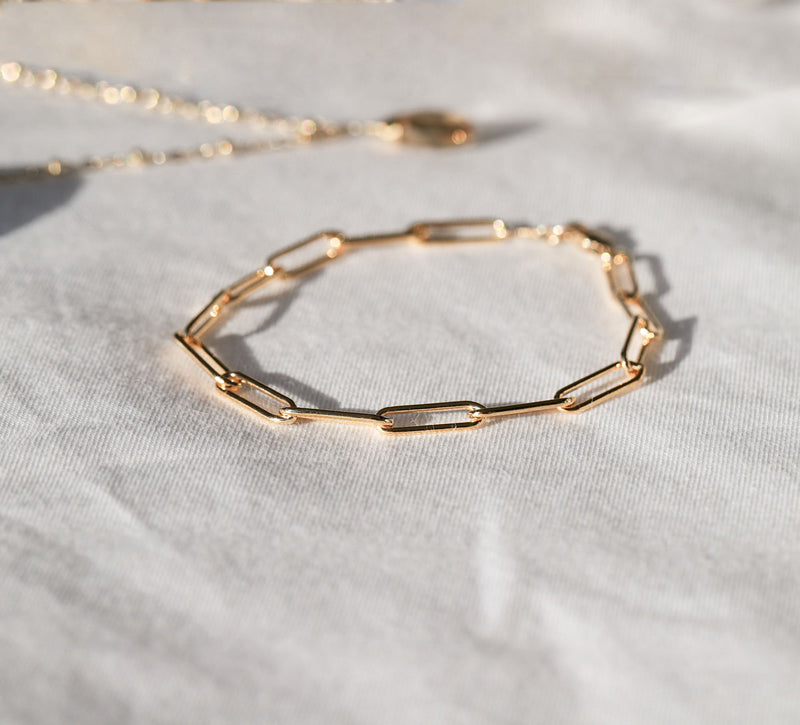 14k gold filled large link chain bracelet on white surface