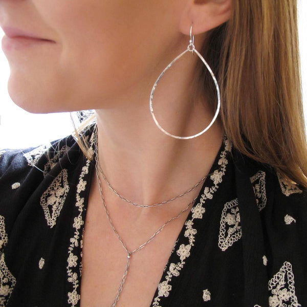 large silver teardrop hoop earrings by delia langan jewelry