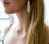 long gold fringe drop earrings by delia langan jewelry