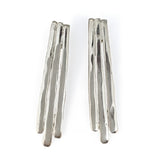 sterling silver long fringe post earrings on white surface 
