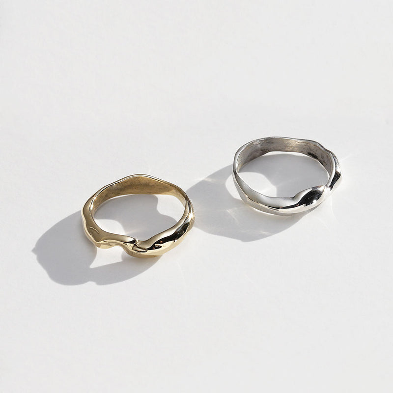 two wavy rings in gold and silver