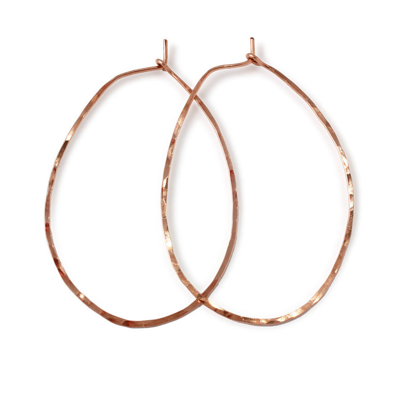 rose gold filled endless oval hoop earrings on white surface