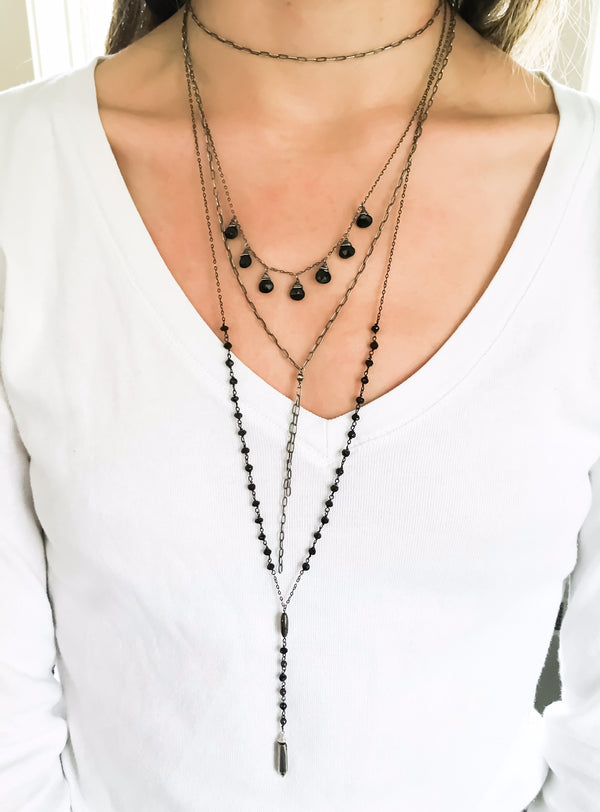 woman cleavage wearing an oxidized sterling silver tied up choker wrap