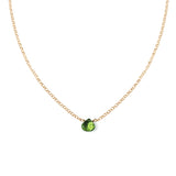 small green peridot pendant on delicate gold chain