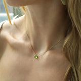 small green peridot pendant on