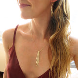 rays pendant gold fringe necklace by delia langan jewelry