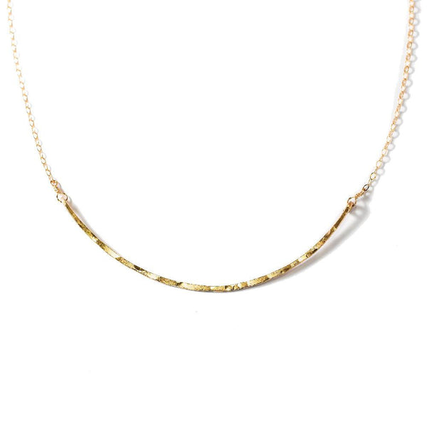 delicate gold arc necklace by delia langan jewelry