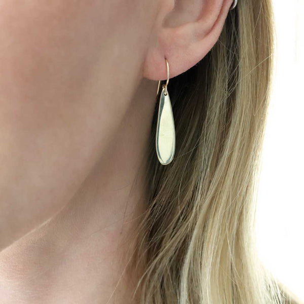 minimalist gold teardrop earrings by delia langan