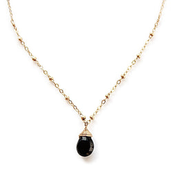 black spinel pendant on beaded gold chain