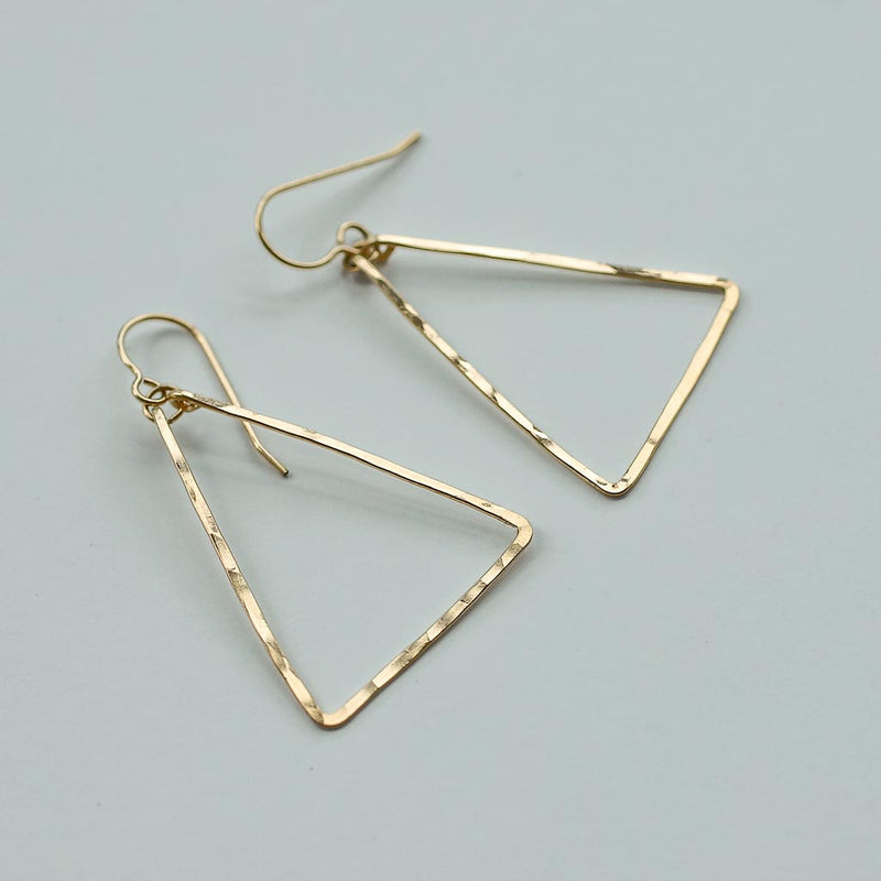 delicate gold triangle earrings by delia langan jewelry