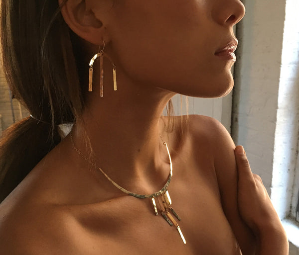 brunette wearing 14k gold filled cascade collar bib necklace