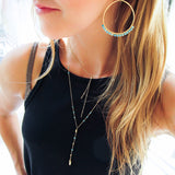 turquoise arc earrings and layering necklaces by delia langan jewelry