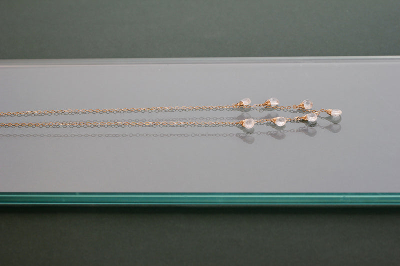 side view of white topaz and 14k gold filled necklace by delia langan jewelry
