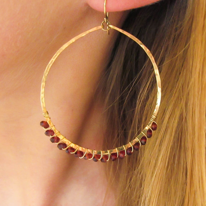 garnet and gold wire wrapped hammered hoop earrings by delia langan jewelry