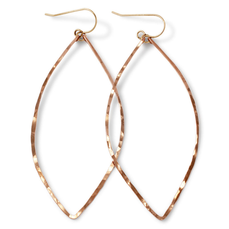 rose gold filled xl leaf hoop earrings on white surface 