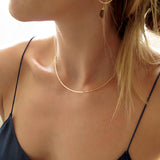 thin gold choker necklace by delia langan jewelry