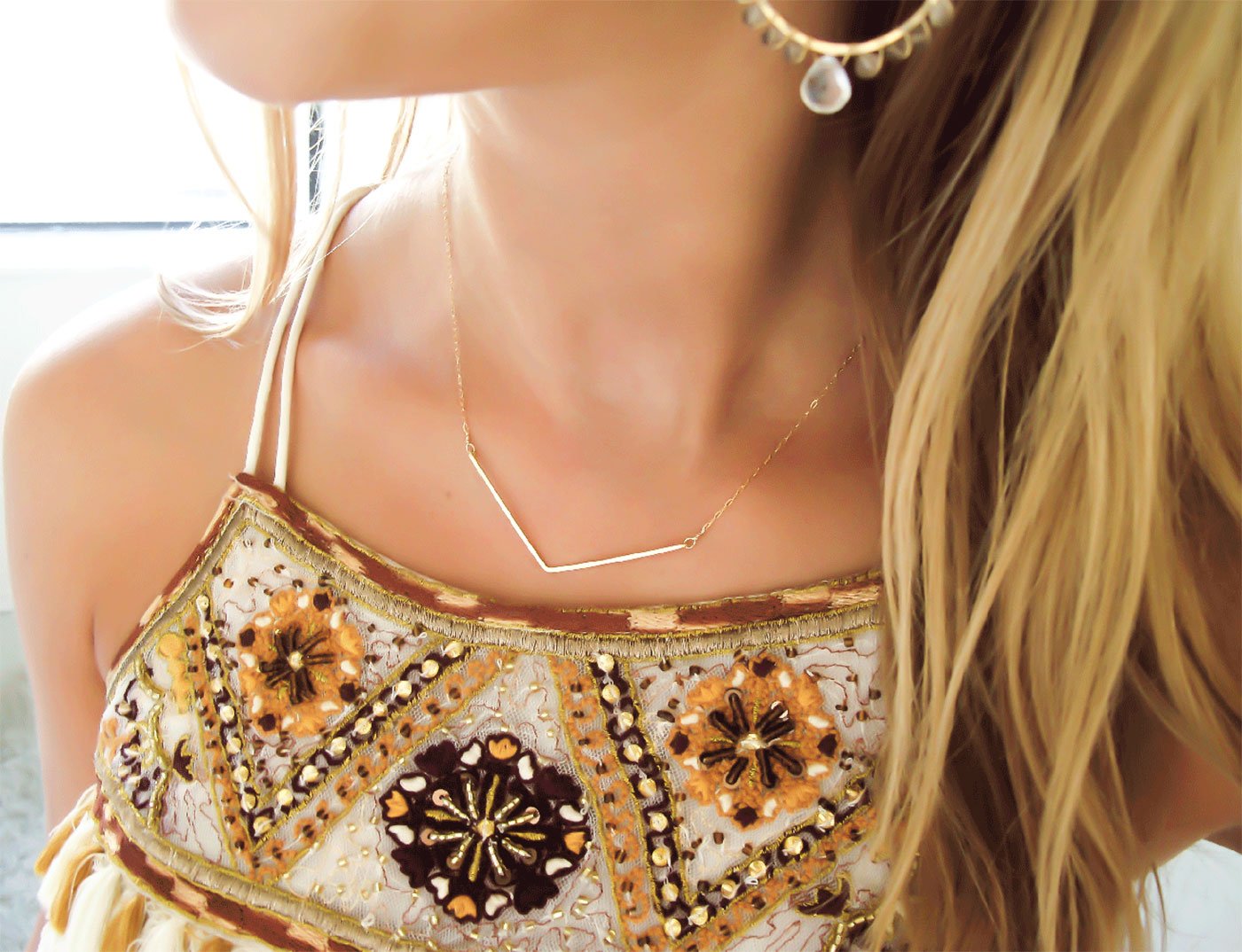 delicate gold hammered chevron v shaped necklace handmade by delia langan jewelry