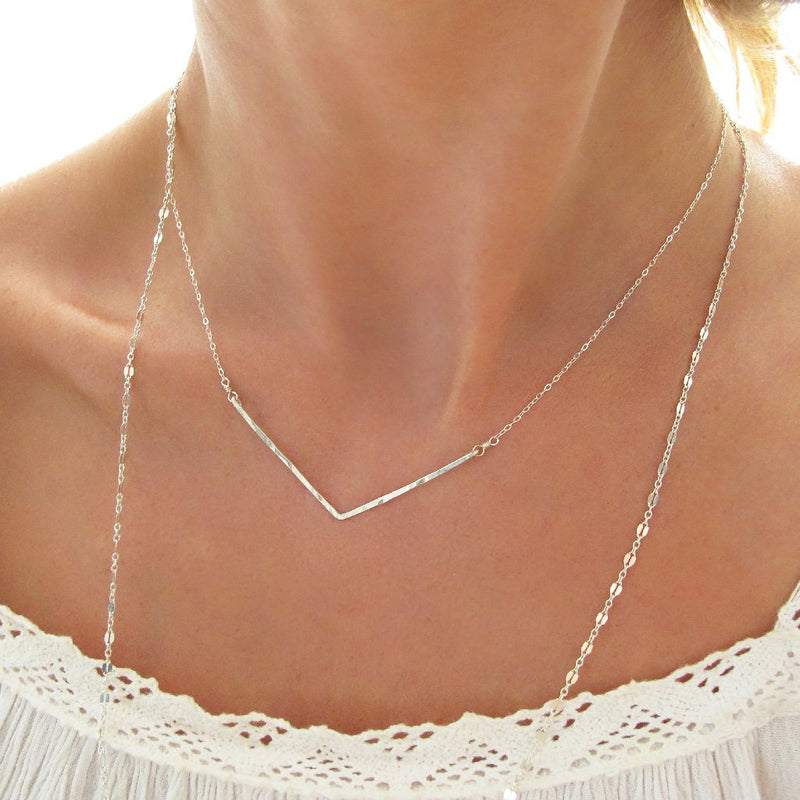delicate sterling silver hammered chevron v shaped necklace layered with silver chain choker necklace handmade by delia langan jewelry