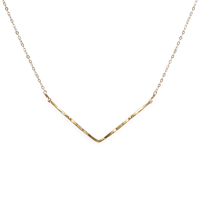 delicate gold hammered chevron v shaped necklace handmade by delia langan jewelry